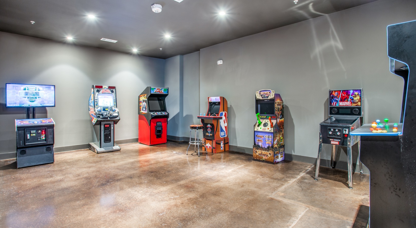 an arcade room with several arcade machines at The Ramble and Rose