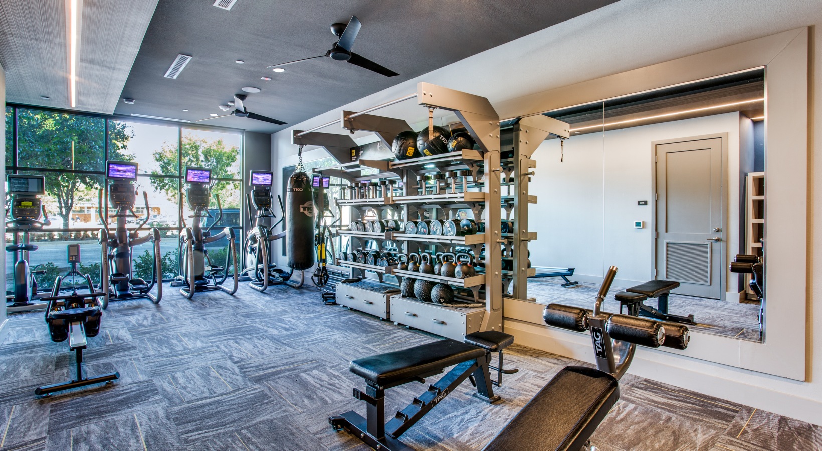 a gym room with weights and exercise equipment at The Ramble and Rose